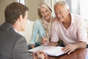 elderly couple working with an estate planning attorney