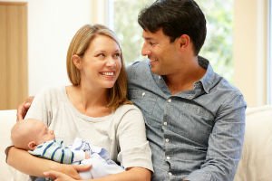 family holding new baby