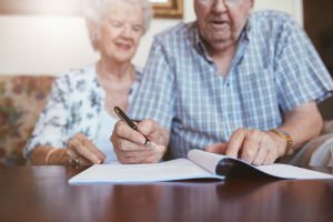 couple preparing and signing a will