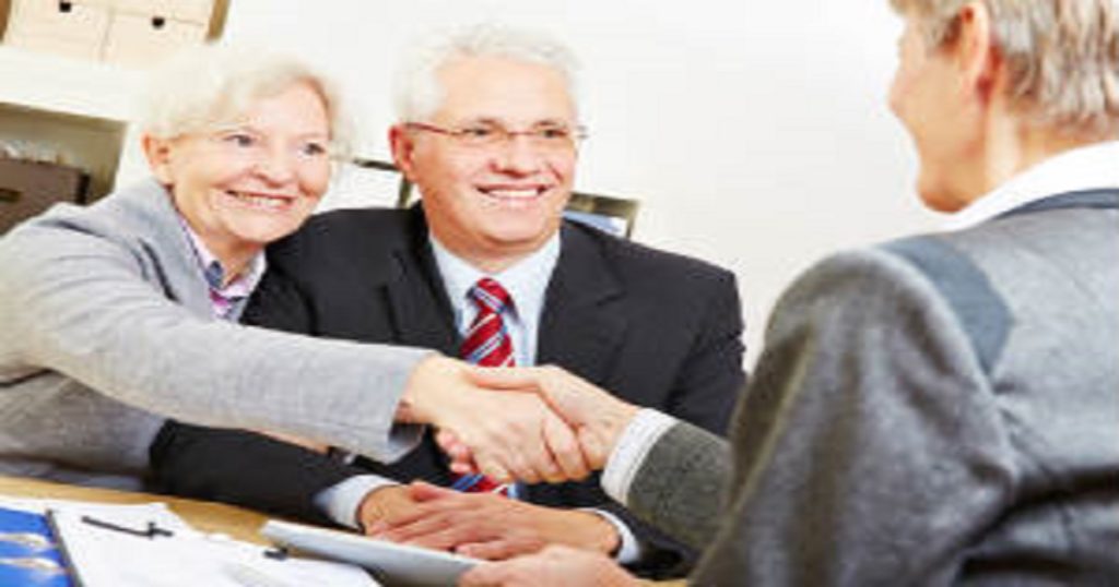 Elderly couple with lawyer