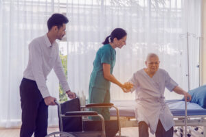 Doctor holding patient's hand, Senior man 80 years has alzheimer's disease.
